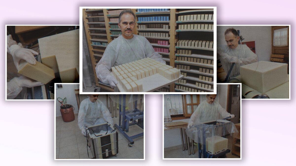 Cutting a large cold-process soap block; rows of fresh bars curing on racks